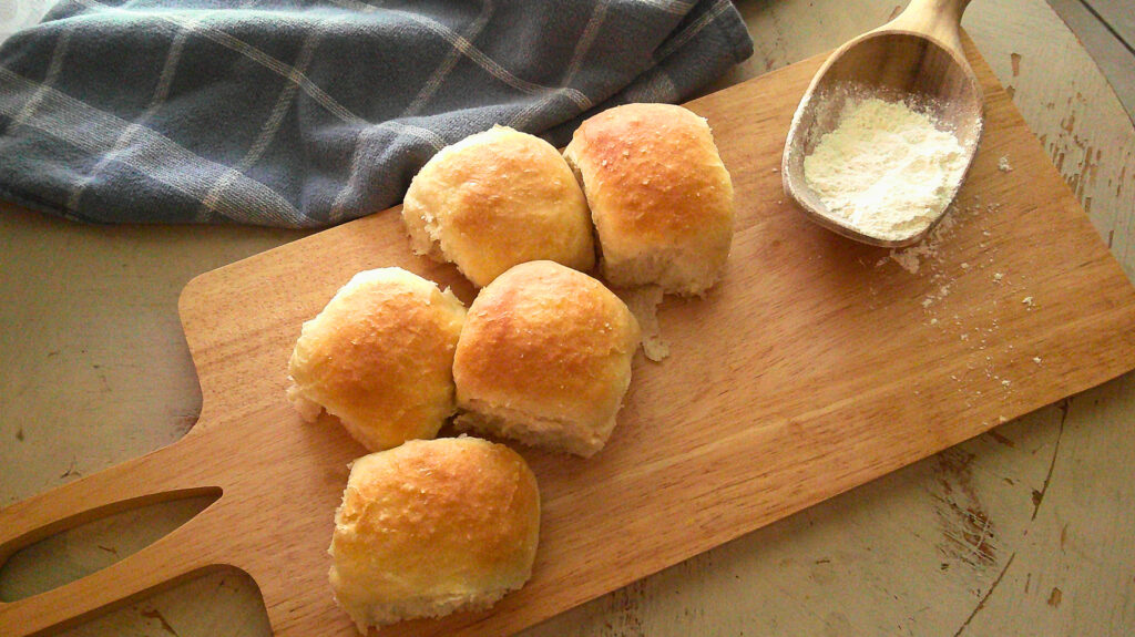 dinner rolls on cutting board